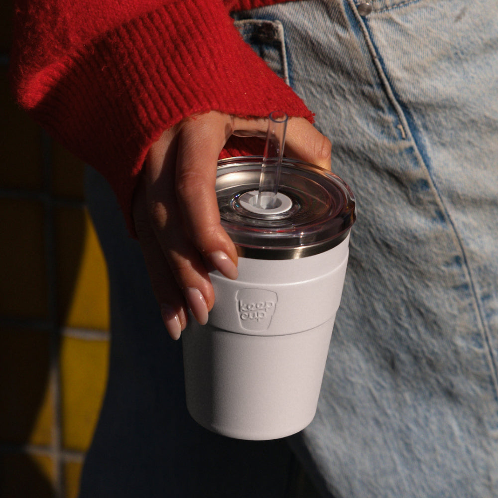 Close up of woman in red jumper with jeans holding Thermal Cold Cup 12oz in White
