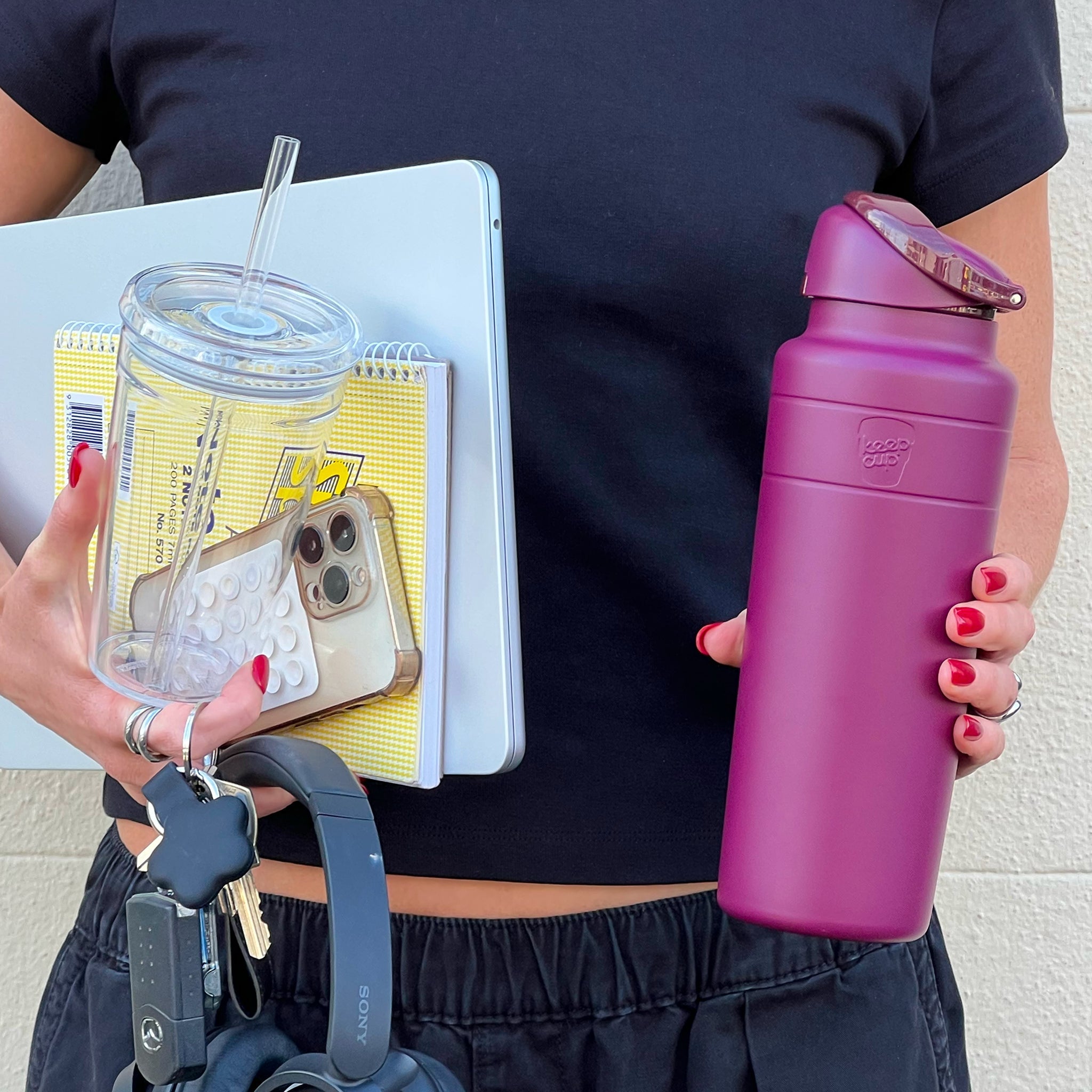 Woman holding Mulberry Ora Water Bottle, Cold Cup Original mobile phone, notebook and keys