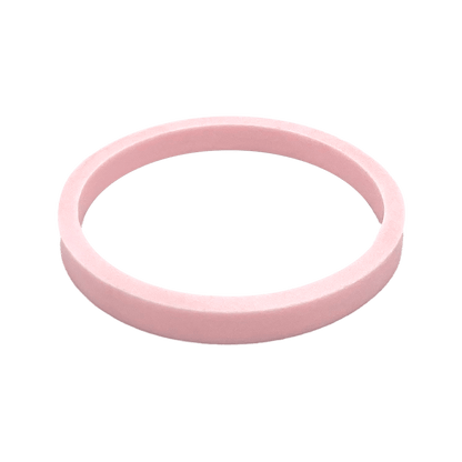 Gasket Helix Light Bottle Lid in Pashmak Pink, a soft pink silicone ring shown at a slight angle against a white background, displaying its circular shape and flat profile.