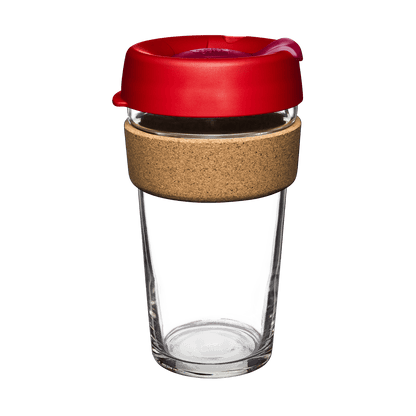 KeepCup Brew Cork L 16oz in Dawnbreak colour, featuring a clear tempered glass cup with natural cork band and red silicone lid with pink plug, shown at a slight angle against a white background.