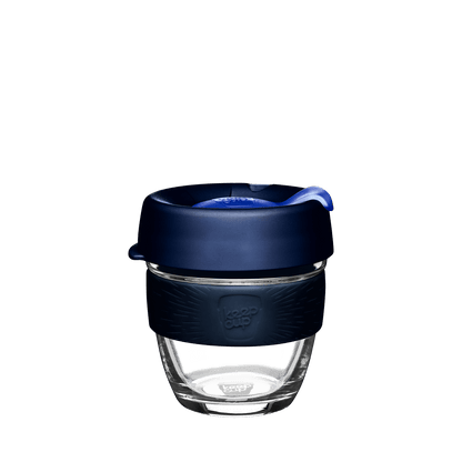 KeepCup Brew S 8oz in Ink colour, featuring a clear glass cup with navy blue silicone band and dark blue lid with matching plug, shown against a white background.