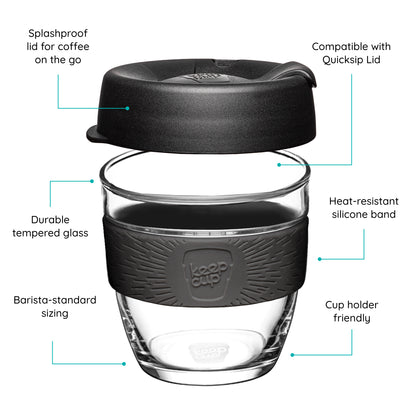 KeepCup reusable glass cup with a black lid and black band on a white background that features text 