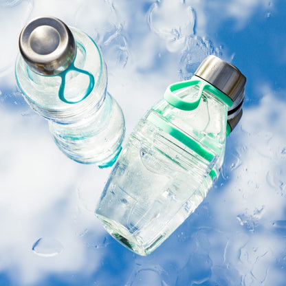 Clear plastic water bottles with green and turquoise accents and stainless steel caps surrounded by clouds