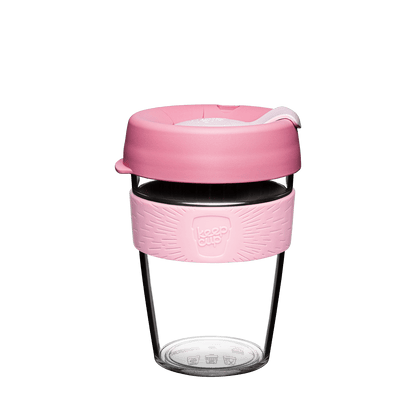 KeepCup Tritan plastic reusable coffee cup with pink silicone sleeve and lid on a white background